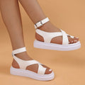 Women's casual Roman-style sandals with outer lace loop-foot buckle, thick sole, black colour, round toe