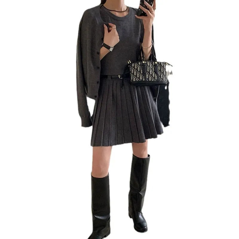 Grey and black women's knitted vest skirt and long-sleeved cardigan two-piece set with a belt.