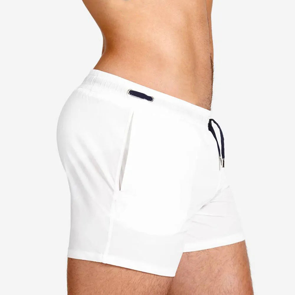 Polyester sports shorts with mesh lining in Army Green colour, laid flat.