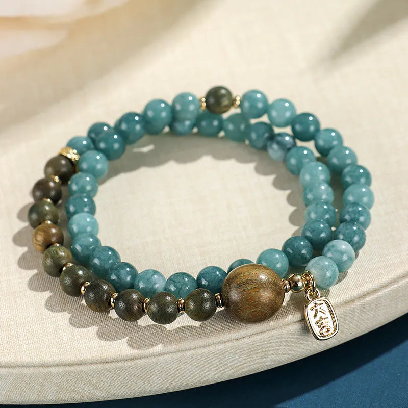Blue gold sandalwood beaded bracelet for women with fu character charm electroplated finish