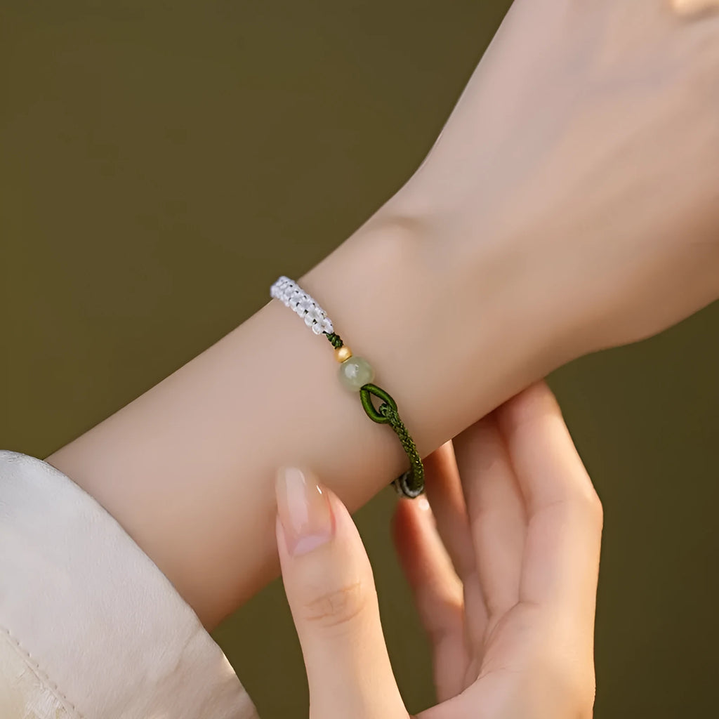 Chinese bracelet with Hetian Jade bead, sterling silver fittings, and adjustable coloured cord strap