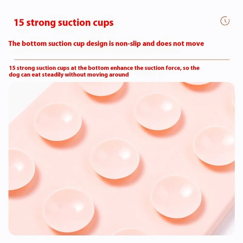 Silicone pet licking mat in gray with suction cup base on a smooth floor