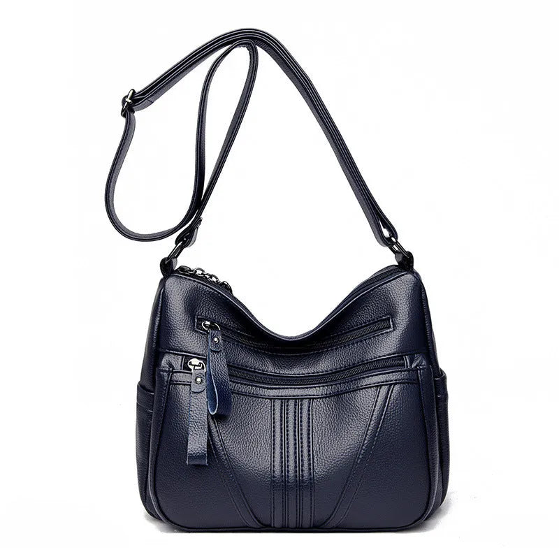 Genuine leather horizontal square messenger bag with contrasting stitching and single shoulder strap in black