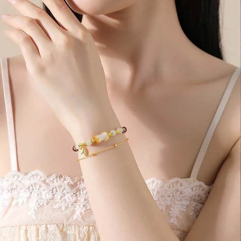 Bamboo special-design glass bracelet in beige with flower shape and Ruyi element, electroplated finish