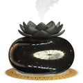 Pure black USB lotus-shaped ultrasonic humidifier and aromatherapy diffuser on a desk.