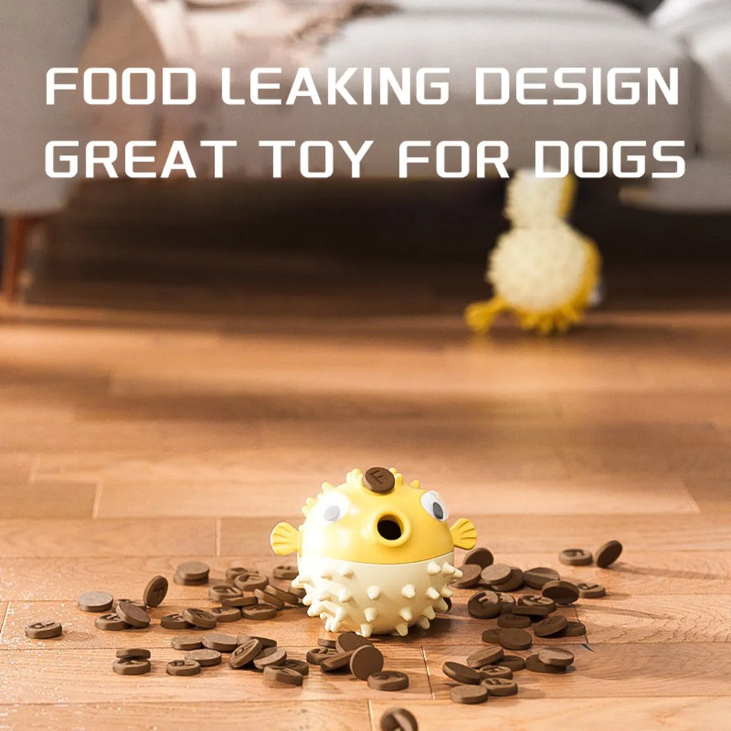 Yellow fish-shaped vinyl dog chew toy with textured surface and squeaker inside.