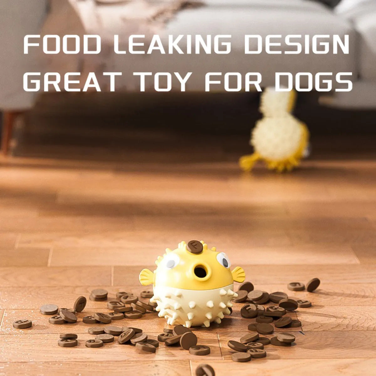 Yellow fish-shaped vinyl dog chew toy with textured surface and squeaker inside.