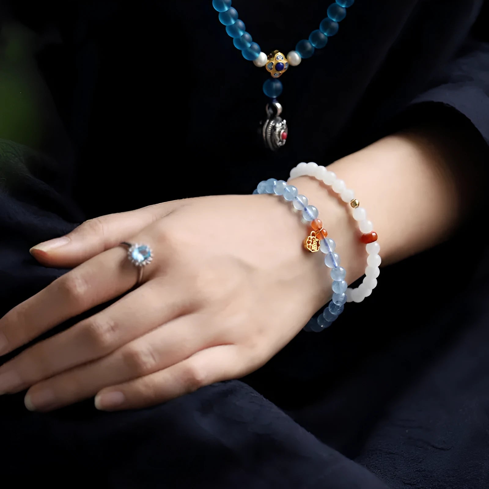 Natural ice translucent 8mm round crystal bead bracelet with sequin accents on display