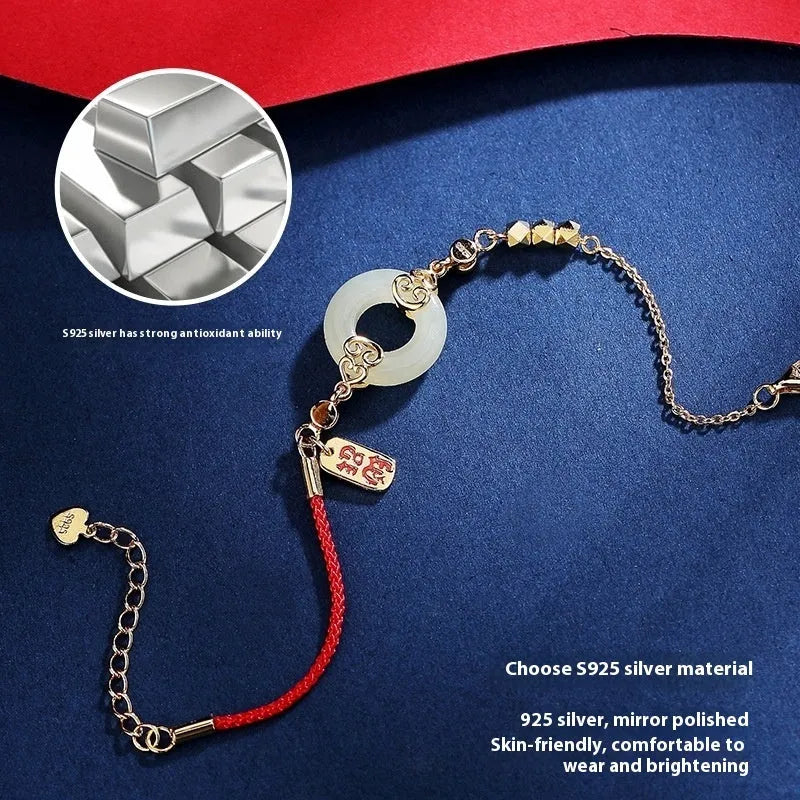 Hetian jade gourd bracelet set in 925 sterling silver with peace buckle and Fu character motifs on white background