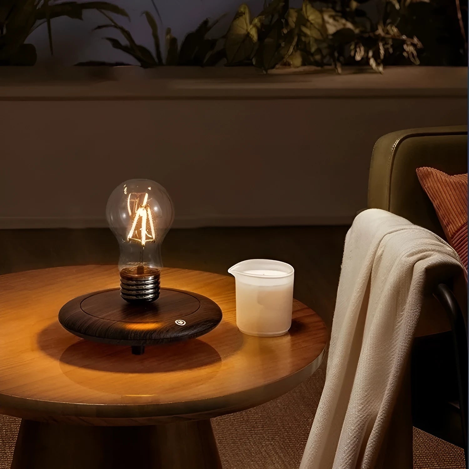 Small black suspension bulb night lamp with iron art body on a wooden base.