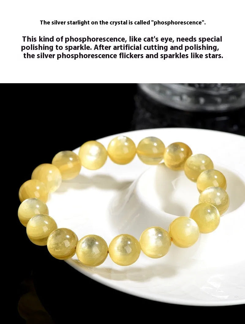 Polished natural mica round beads bracelet in yellow Lepidolite colour on flat surface