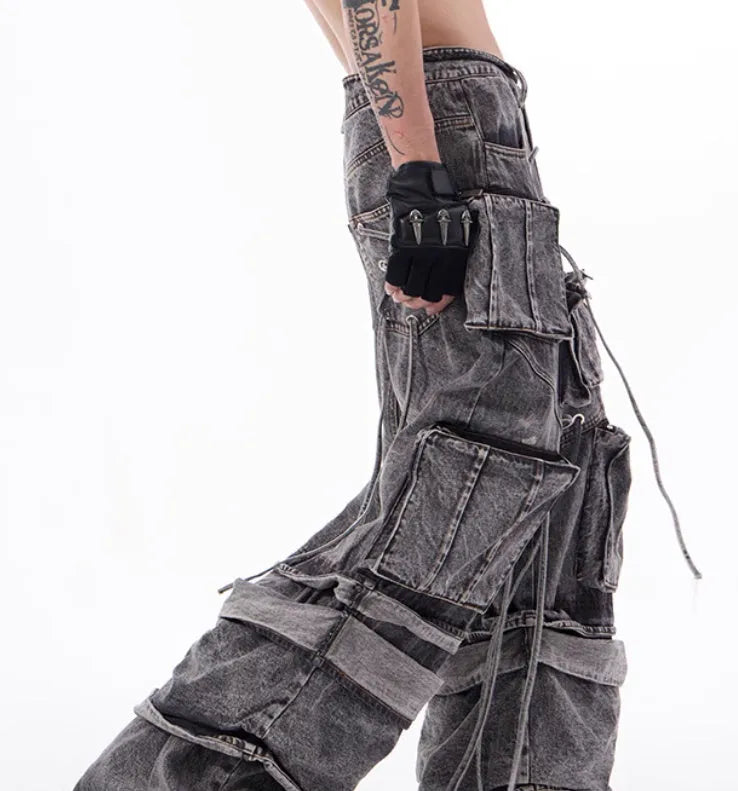 Grey cotton denim distressed overalls with rope stitching in mop pant style on model