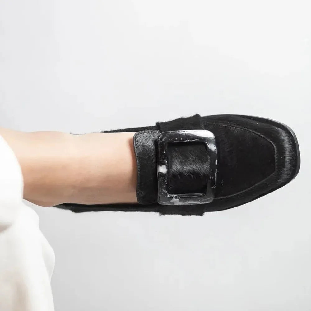 Low-cut black loafers for women with large square button and rhinestone details, round toe, low heel
