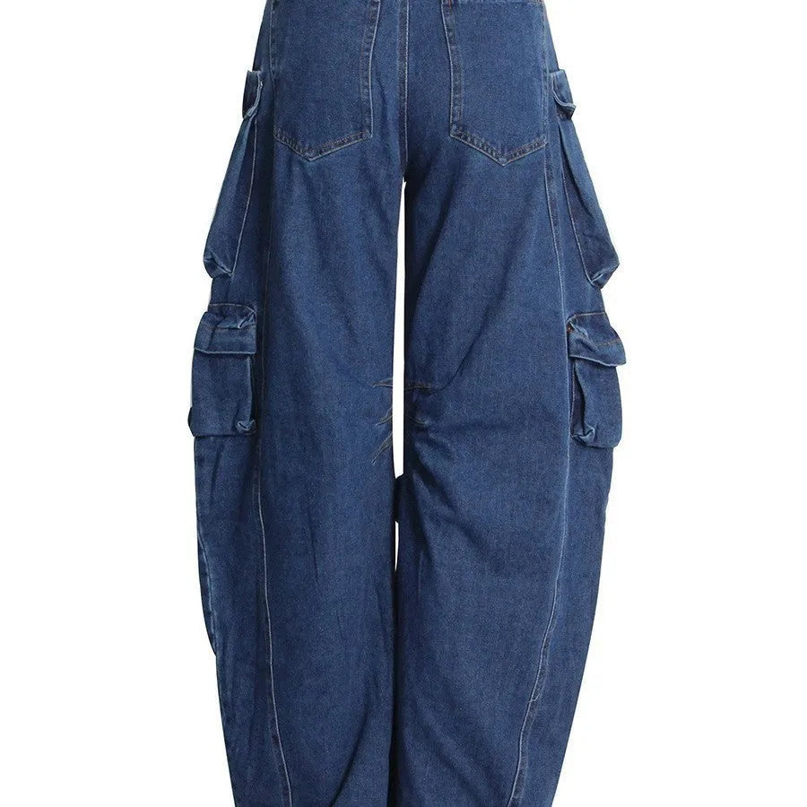 Dark blue distressed women's jeans with wide legs, high waist, and multiple pockets on a neutral background.