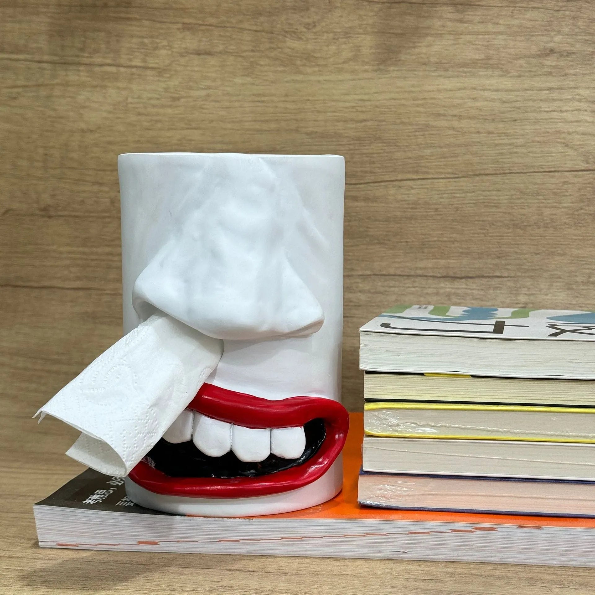 Resin tissue box holder with colourful humorous American style artwork measuring 8.5cm by 14.6cm