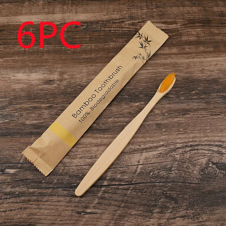 10 bamboo toothbrushes with soft charcoal bristles in assorted colours arranged fanned out