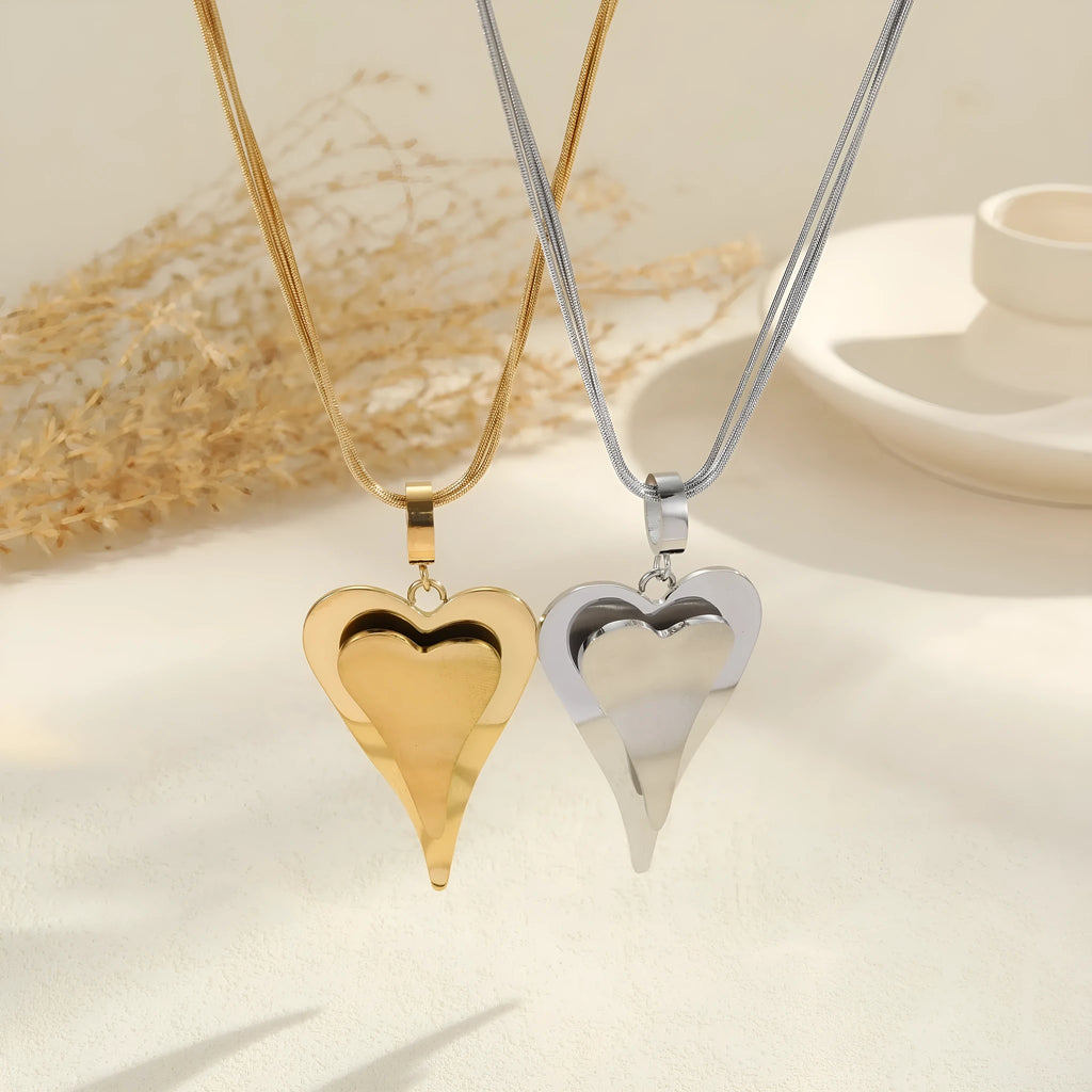 Stainless steel necklace with double heart pendant and snake bones chain design
