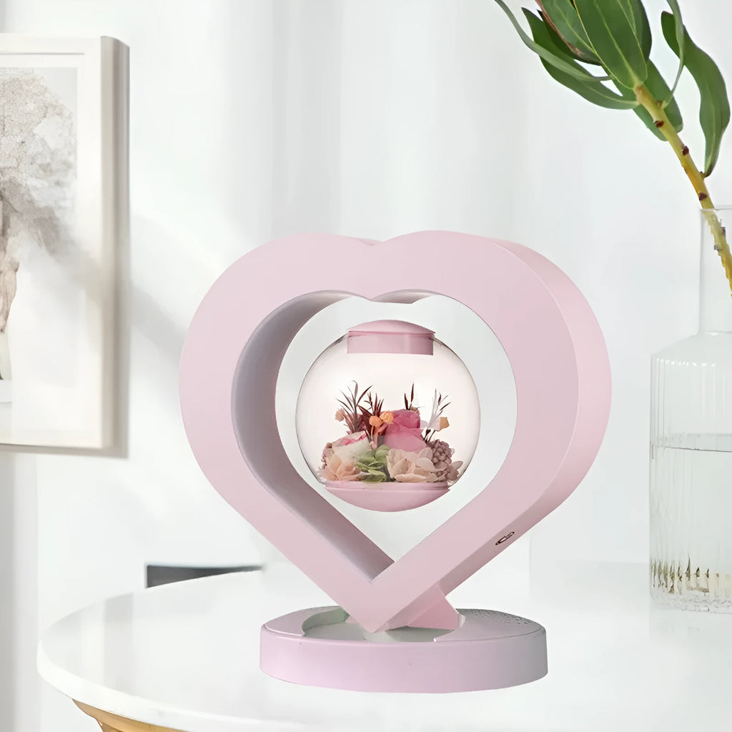 Pink preserved rose in ABS PC PVC ornament with Bluetooth base on tabletop