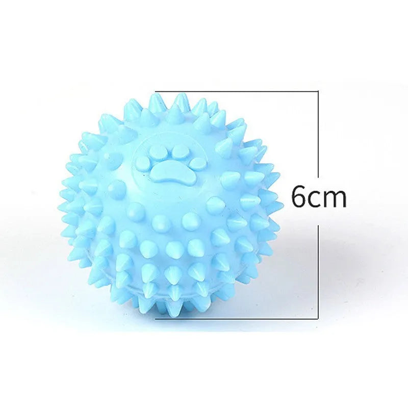 Close-up of 6cm TPR rubber dog chewing toy ball with footprint pattern in blue pink or yellow for tooth cleaning