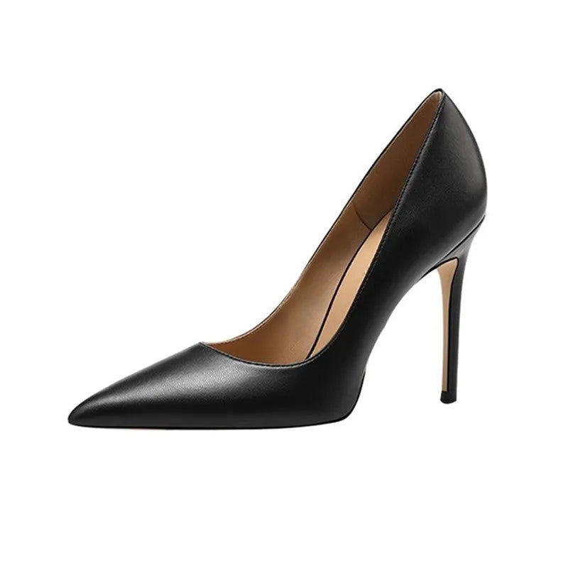 Black pointed high heel shoes with stiletto heel and microfiber upper on a white background