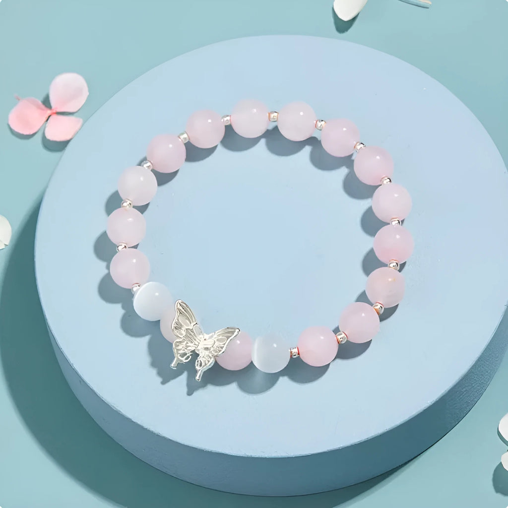 Cat eye crystal bracelet for women, bow shape, pink crystal option, on white background