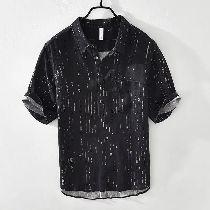 Men's loose fit short sleeve lapel polo shirt in black or white, shown on a hanger.