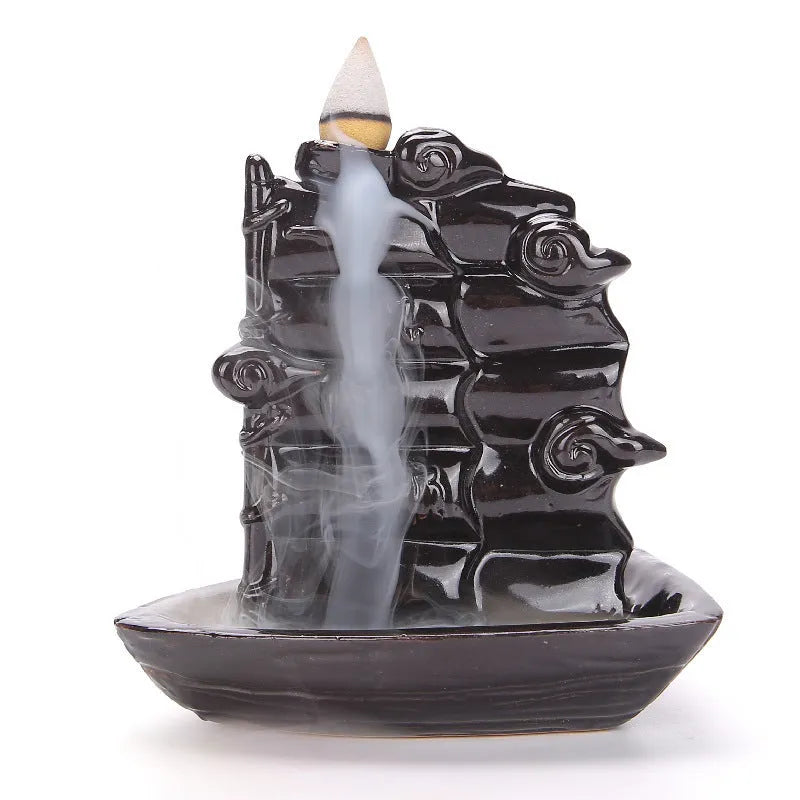 Creative ceramic backflow incense burner ornament in modern simplicity style with smoke cascading downwards