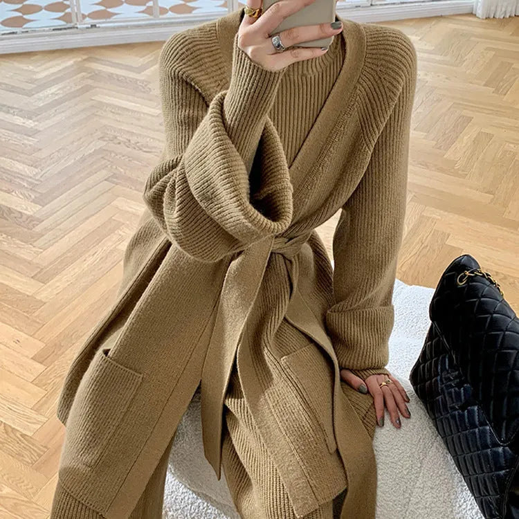 Women's knitted three-piece set showing wide-leg pants, sweater and cardigan with leather stitching details
