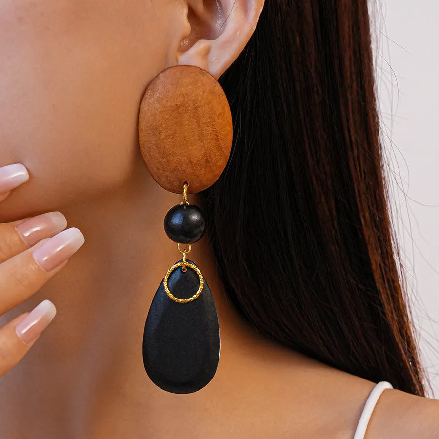 Handcrafted wooden retro earrings with elliptical design in silver brown black colours