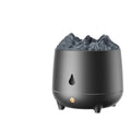 White volcano-shaped ultrasonic humidifier and aromatherapy diffuser with USB cable on a wooden table.