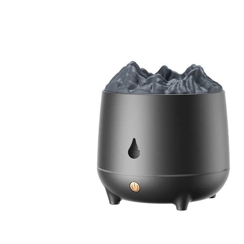 White volcano-shaped ultrasonic humidifier and aromatherapy diffuser with USB cable on a wooden table.