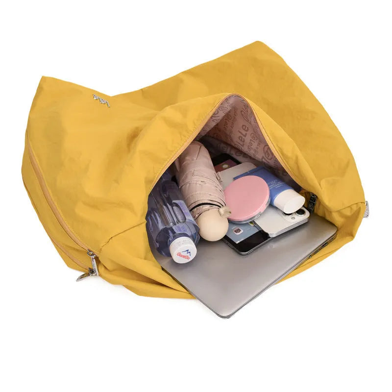 Soft nylon heart-shaped underarm bag for women in black, blue, khaki, or yellow.