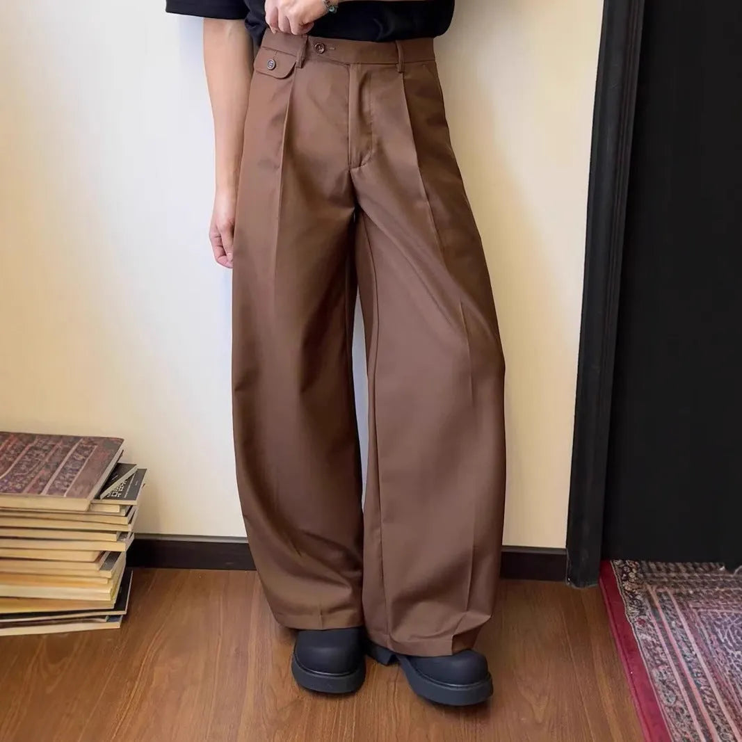 Men's brown straight-leg loose wide-leg casual suit trousers laid flat.