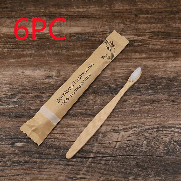 10 bamboo toothbrushes with soft charcoal bristles in assorted colours arranged fanned out