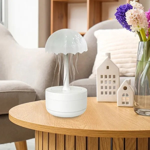White resin jellyfish humidifier diffuser with 7-colour night light and touch controls on a desk