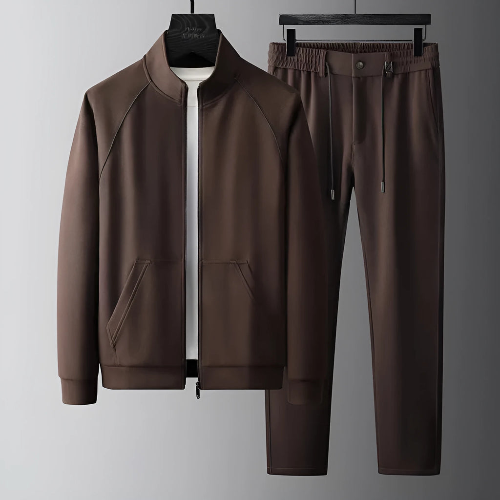 Man wearing a stand collar Vinylon sports suit set in slim fit, showing the coat and trousers.
