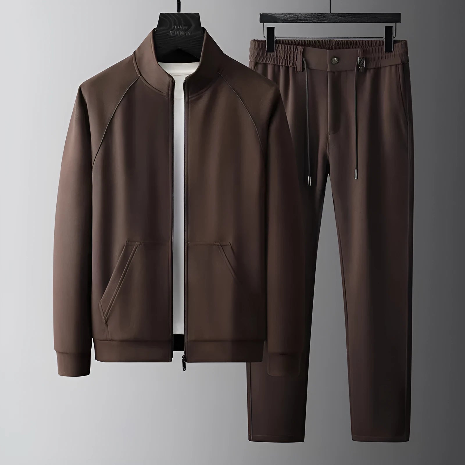 Man wearing a stand collar Vinylon sports suit set in slim fit, showing the coat and trousers.