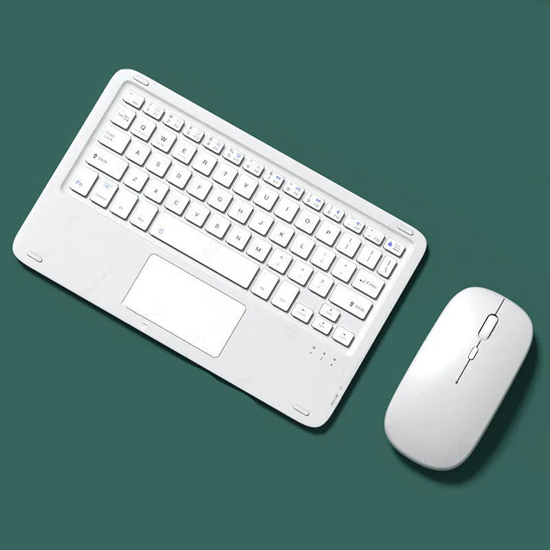 Pink wireless Bluetooth keyboard and mouse combo set with slim touch keyboard and charging cable on a desk.