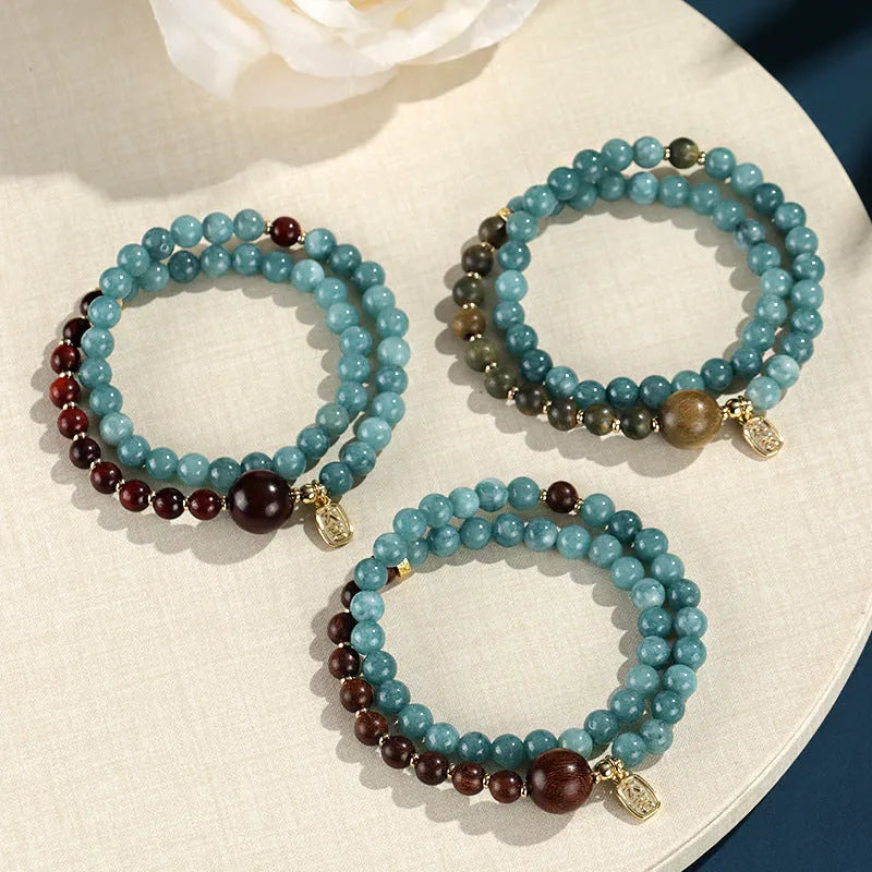 Blue gold sandalwood beaded bracelet for women with fu character charm electroplated finish