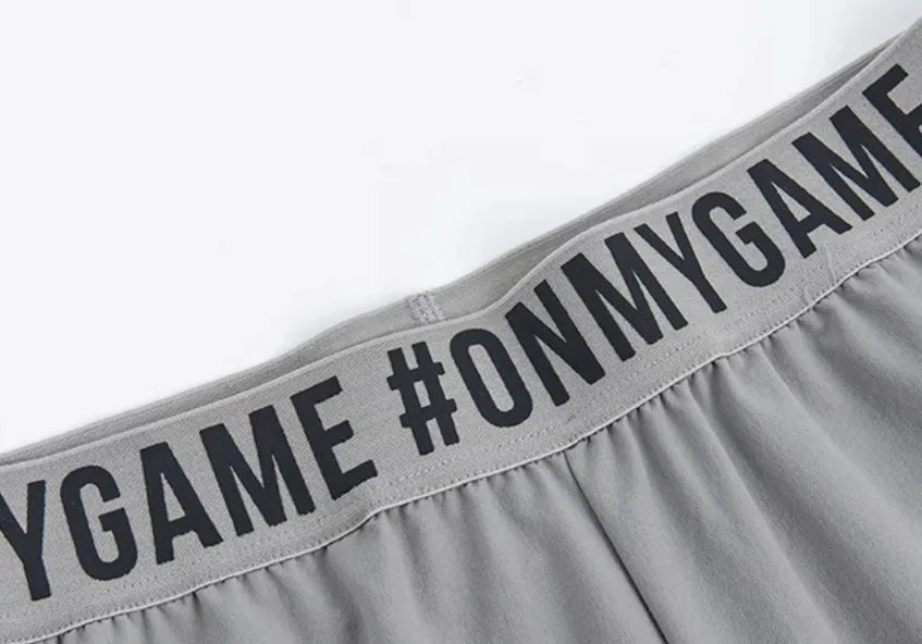 Loose cropped sports trousers in grey with printed waistband, moisture-wicking fabric for women