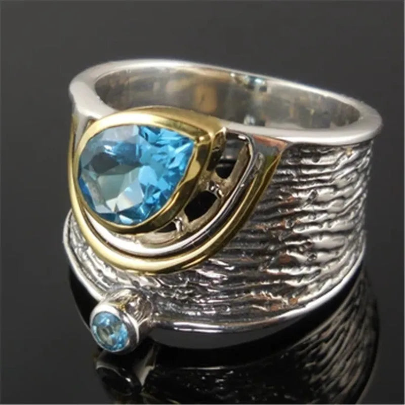 Close-up of a blue drop-shaped zircon rhinestone set in a creative Chinese style alloy women's ring.