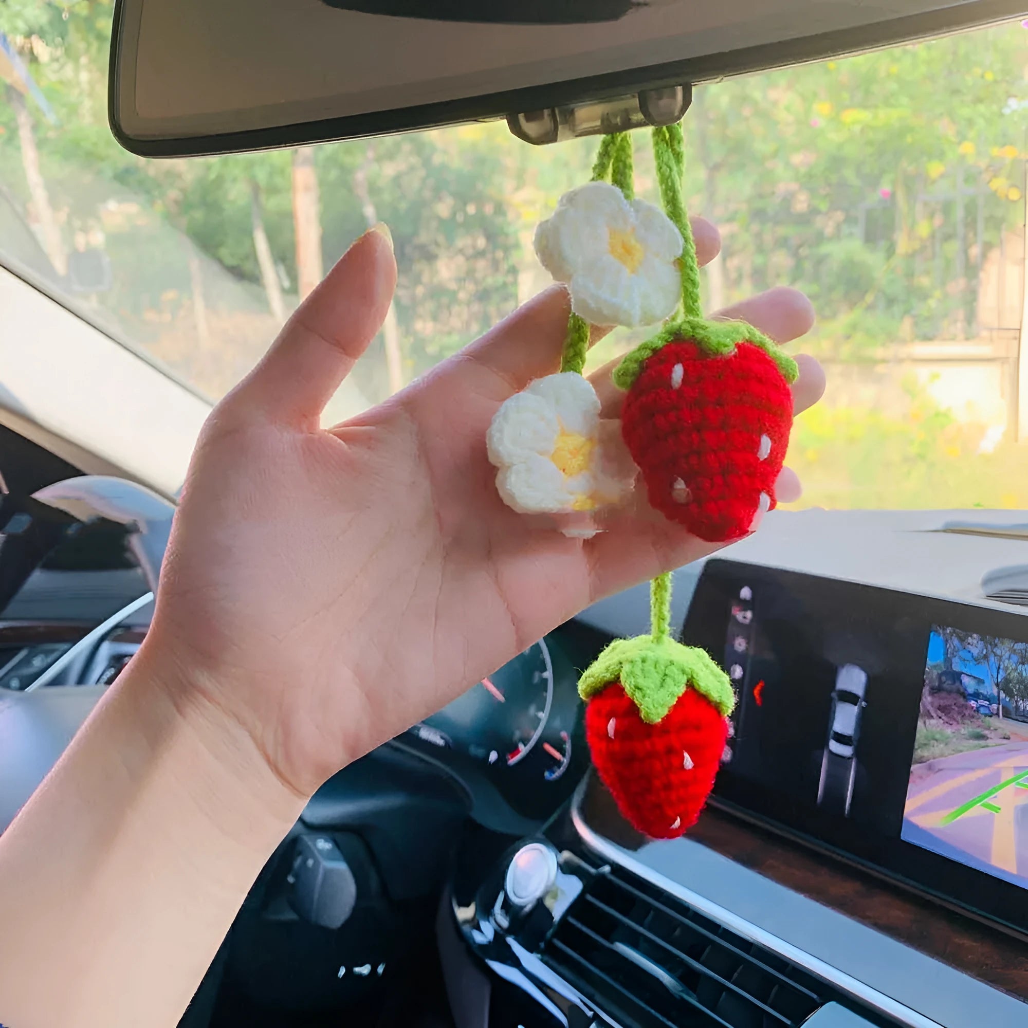 Handmade strawberry-shaped car weaving pendant made from cotton and hemp fibres.