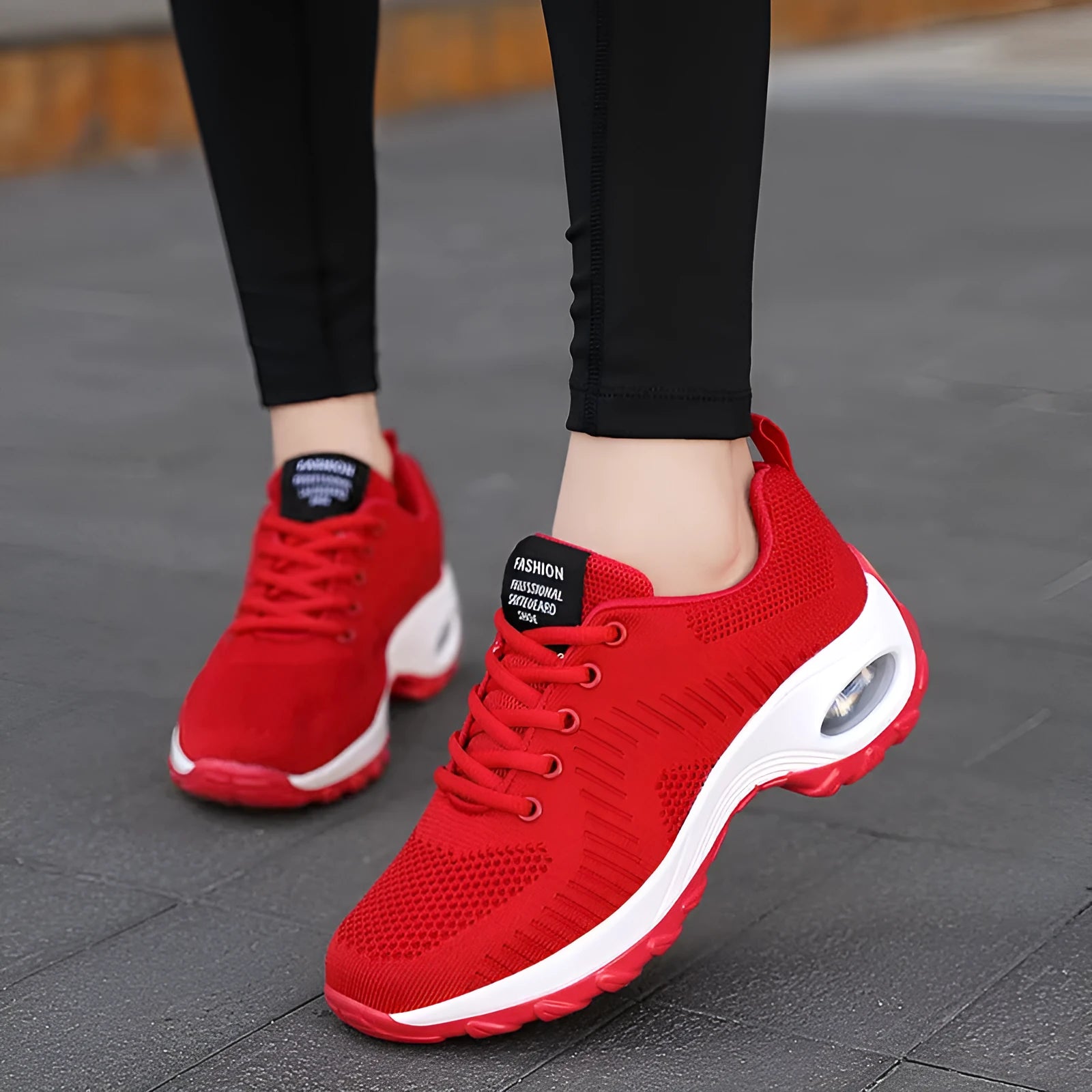 Women's black mesh sneakers with front lace-up design and round toe