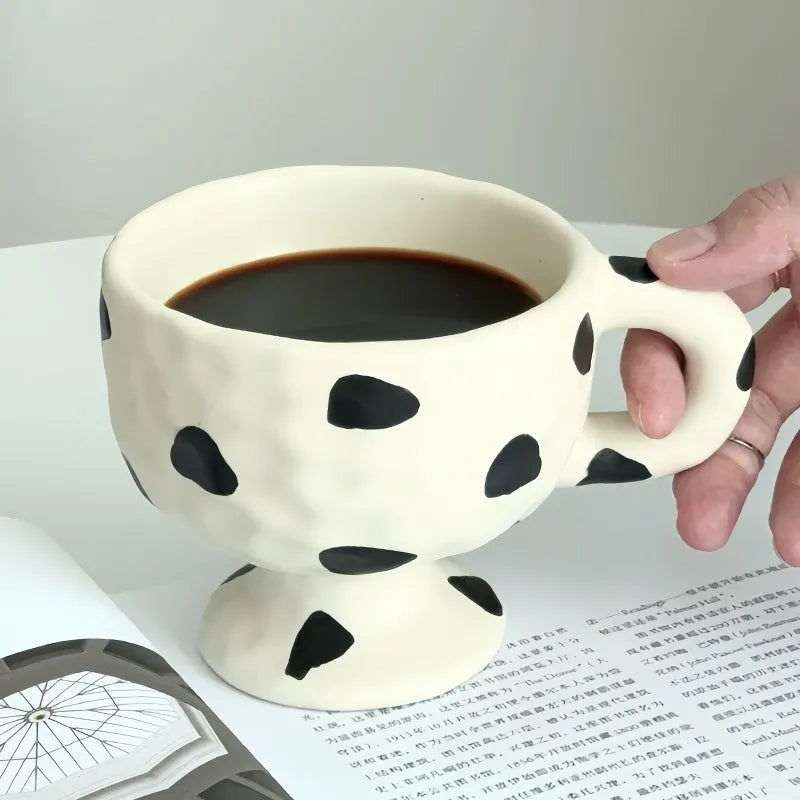 Hand-pinched irregular shaped ceramic mug in solid colour with 250ml capacity