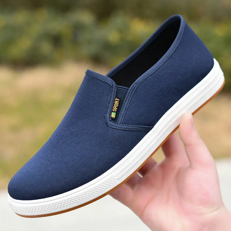 Men's black canvas slip-on shoes with round toe and injection-moulded sole