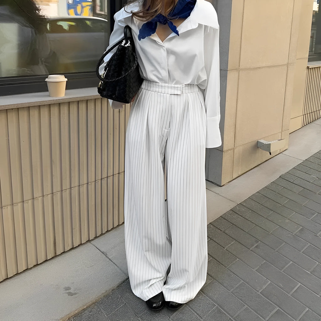 White striped wide-leg casual trousers with zipper closure on mannequin