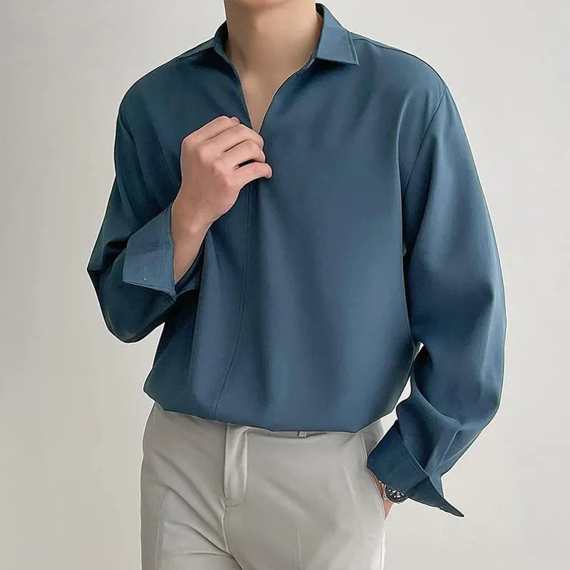 Men's loose fit long sleeve casual shirt in a solid colour, featuring a non-iron lightweight polyester blend fabric.