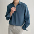 Men's loose fit long sleeve casual shirt in a solid colour, featuring a non-iron lightweight polyester blend fabric.