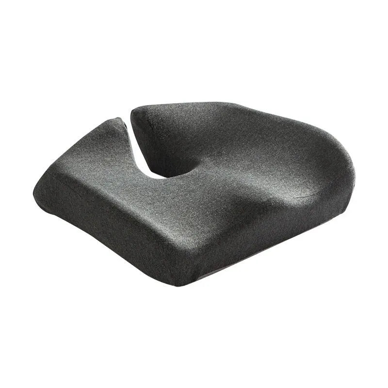 Memory foam office chair cushion in a solid colour, shown on a desk chair for scale.