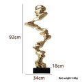 Modern abstract still life sculpture ornament in bright gold, elegant silver, or phantom blue.